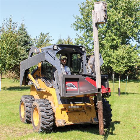 skid steer pulling out trees|skid loader tree puller attachment.